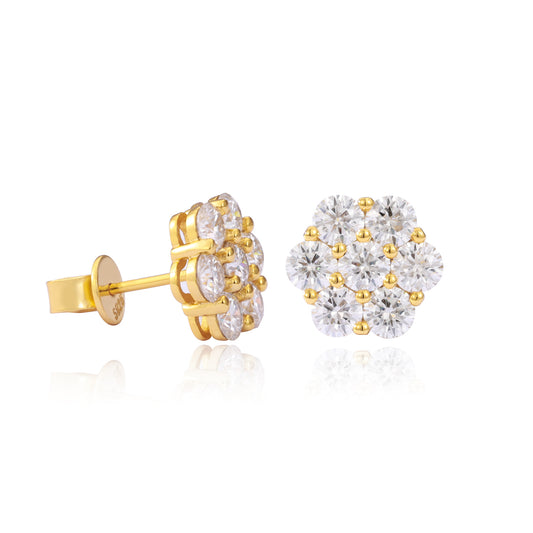 Gold and diamond earrings on a white background